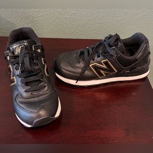 New Balance Black & Gold 574 sneakers